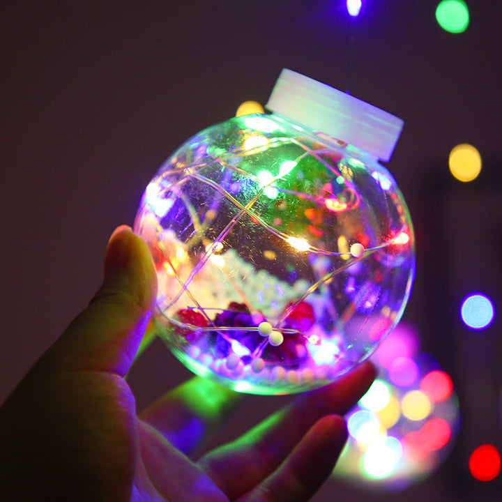 Lichtgordijn met kerstballen en kerstfiguren