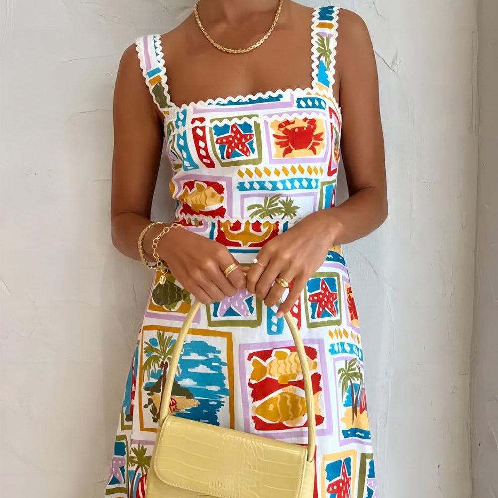 
                  
                    Sienna - Tropische Maxi-Jurk met Vierkante Hals en Zomerse Print - SkinzLine
                  
                