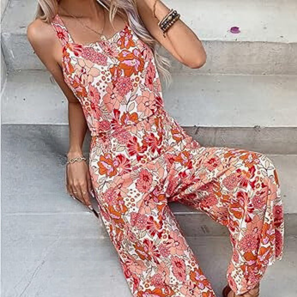 
                  
                    Elvarie – Mouwloze Jumpsuit met Bloemenprint en Wijde Pijpen - SkinzLine
                  
                