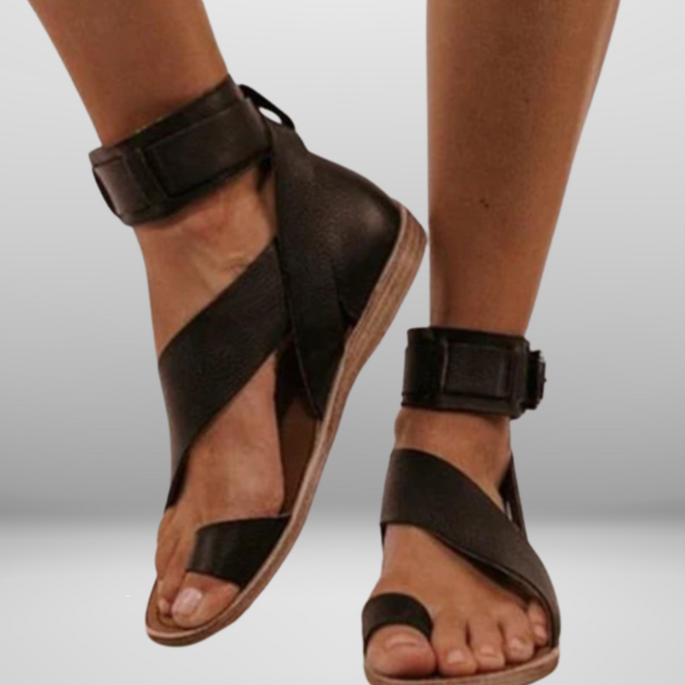
                  
                    Luvessa – Elegante Sandalen met Enkelband en Minimalistisch Kruisdesign
                  
                