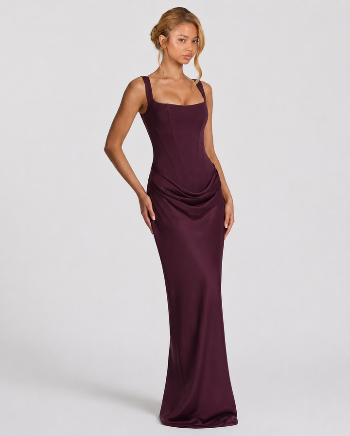 Corset-maxi-jurk met gedrapeerde rok en vetersluiting op de rug.