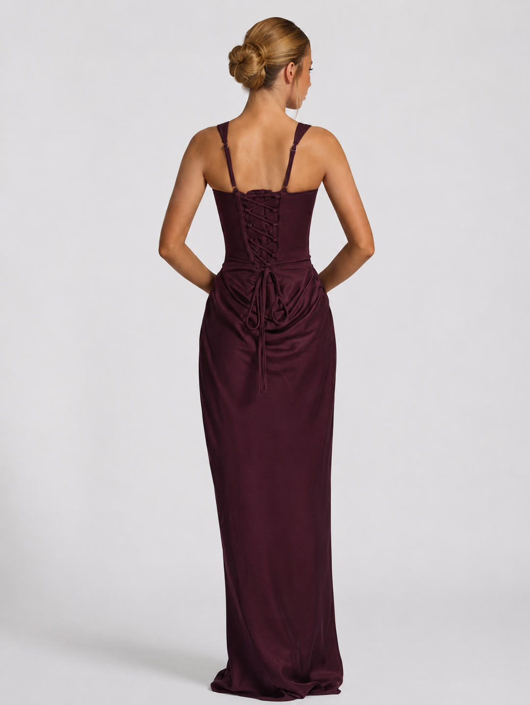 Corset-maxi-jurk met gedrapeerde rok en vetersluiting op de rug.