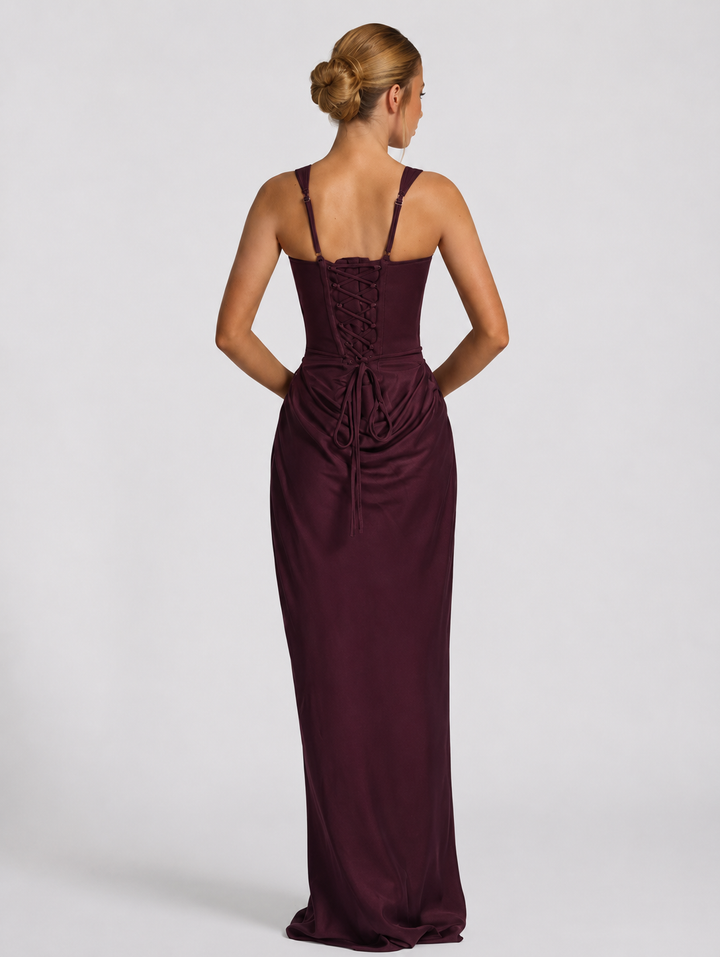 Corset-maxi-jurk met gedrapeerde rok en vetersluiting op de rug.