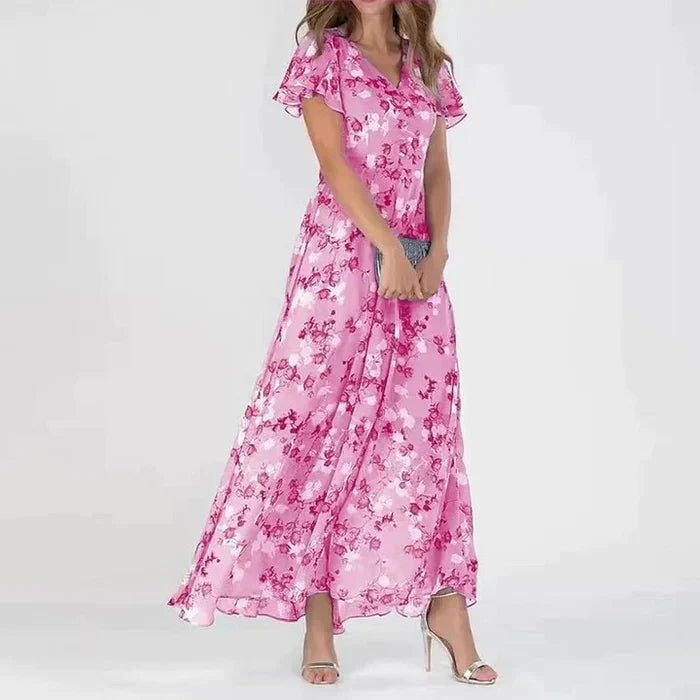 
                  
                    Elvianne – Lange Zomerjurk met Levendige Bloemenprint - SkinzLine
                  
                