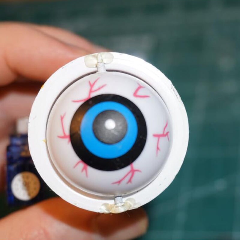 Halloween-pompoenlantaarn decoratie met animatronic bewegende ogen voor enge feestrekwisieten