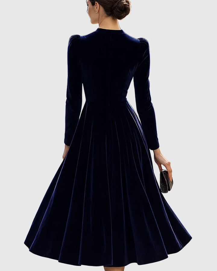 Marineblauwe fluwelen midi-jurk met lange mouwen