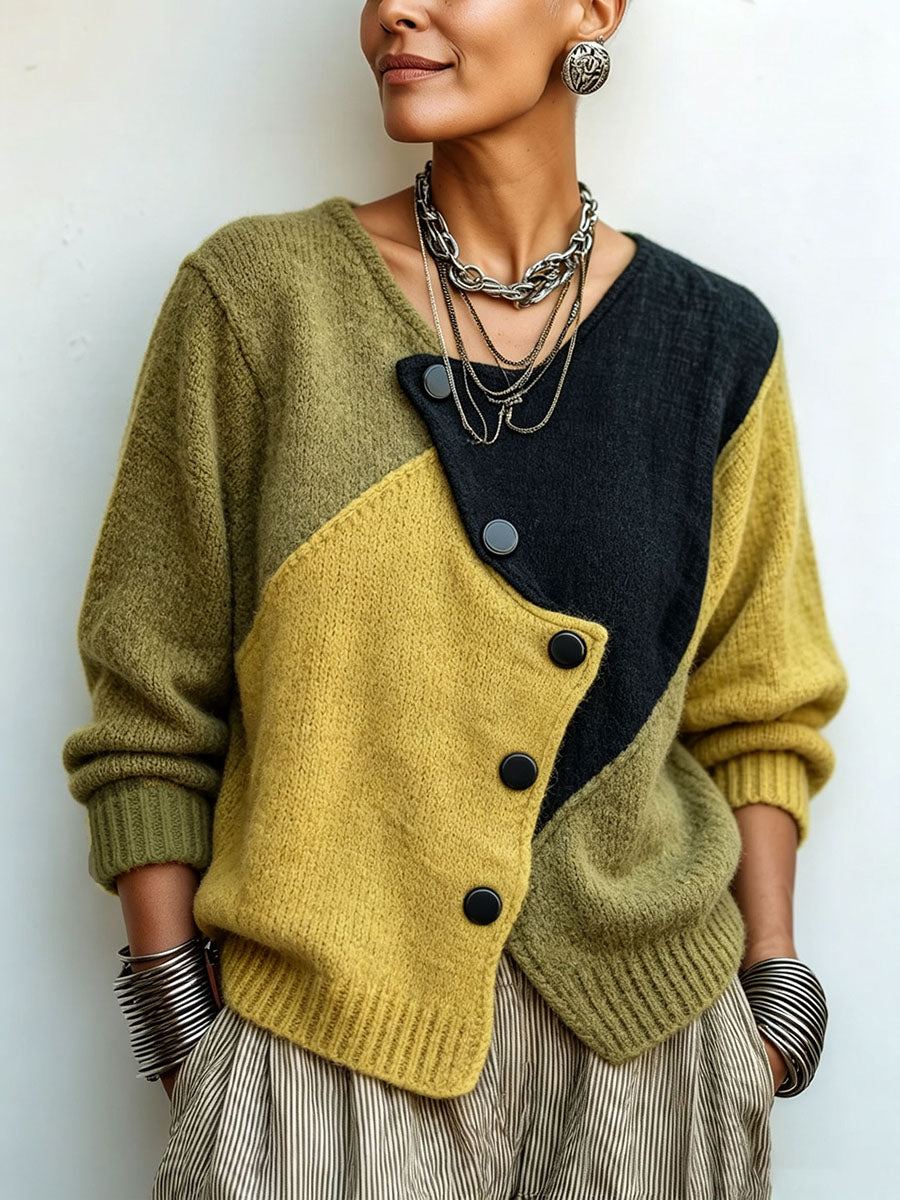 Gebreide damestrui met asymmetrische knopen in colour-block-look
