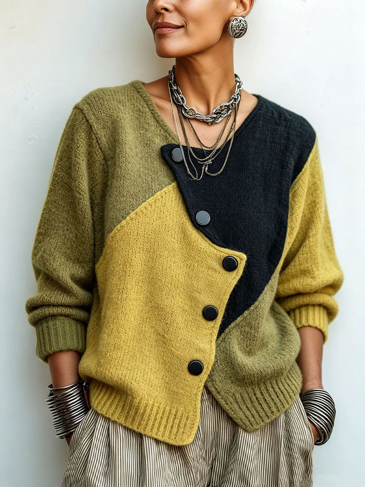 Gebreide damestrui met asymmetrische knopen in colour-block-look