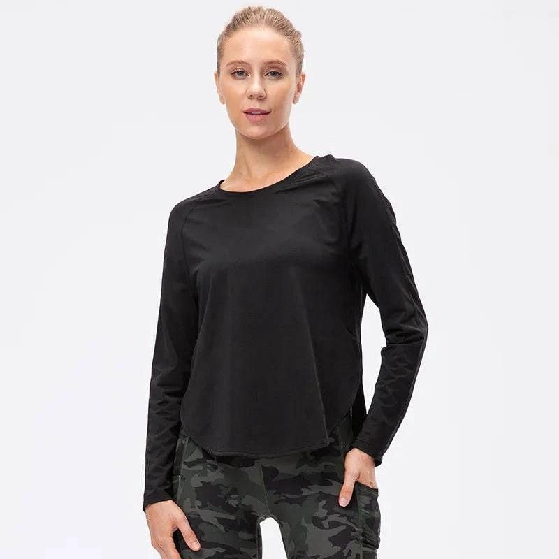 
                  
                    Naadloze Sporttop met Lange Mouwen – Plus-Size - SkinzLine
                  
                
