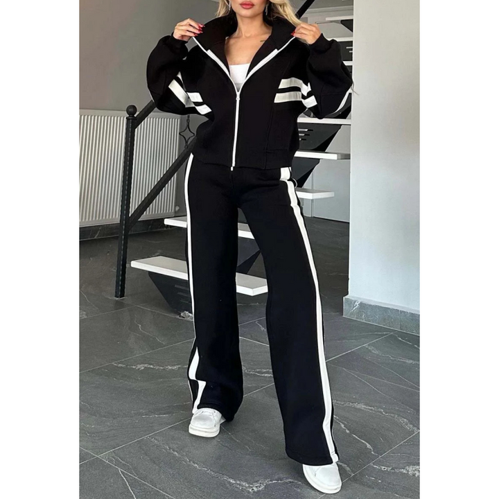 Vrijetijdsset voor dames met vest met rits en broek met wijde pijpen en contraststrepen