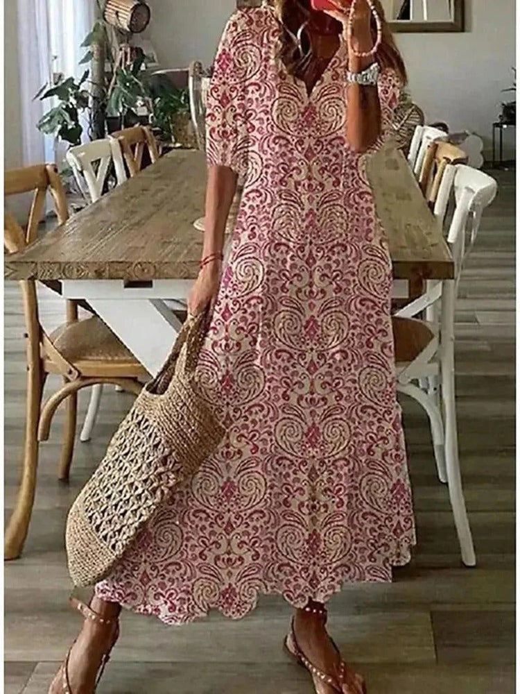 
                  
                    Isla - Lange Bohemien Jurk met Blad- en Streepmotieven - SkinzLine
                  
                
