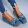 Platte moc-toe loafers met kwastjes en goudkleurige gesp